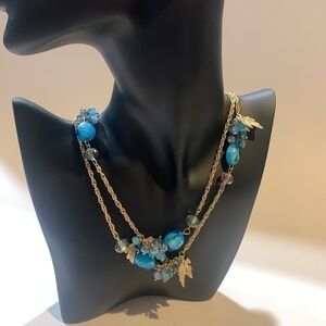 Vintage gold tone necklace with turquoise beads.